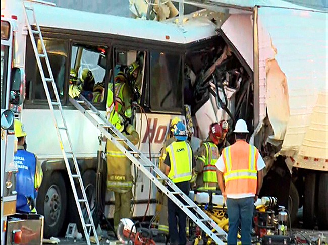 At least 3 dead after tour bus, truck crash in California